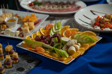 Cover the buffet table. Canape and fruit plate.