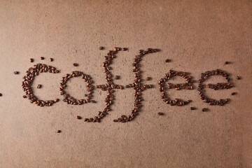 The word 'coffee' made with coffee beans.