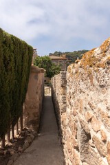 Fototapeta premium wall of tossa de mar a sunny summer day