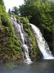Fototapeta na wymiar Japanese waterfall in the mountains, year 2012