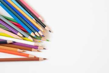 Crayons on a white background. education concept. The concept of kindergarten during the pandemic. The concept of pedagogy.