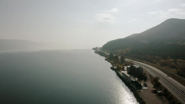 Aerial view of Sevan lake and Yerevan-Sevan highway and beautiful pine forest