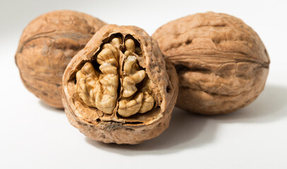 Walnuts are rounded, single-seeded stone fruits of the walnut tree. Cracking a nut.