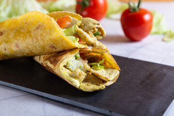 Chicken wrap with salad and tomato. Idea for a tasty and healthy lunch.