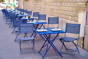 French restaurant - tables and chairs in the row - 490311095