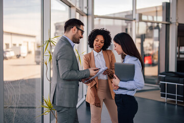 Helpful caucasian businessman, showing the company bugdet to his