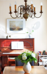Flowers in the house. A warm photo of flower and dinning room (Danish).