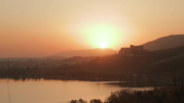 Static shot of gorgeous sunset in Sevan lake, Armenia. Warm mood and warmish colours in Sevan peninsula