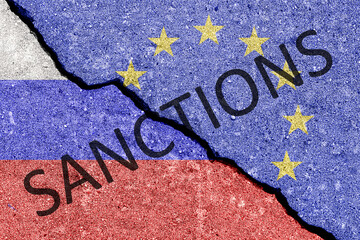 The crack between the Russian Federation and European Union flags. The concept of sanctions. - obrazy, fototapety, plakaty