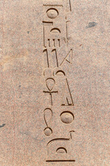 Ancient Egyptian murals and writings on the stone walls of the Karnak Temple in Luxor