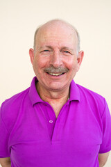 Portrait of senior man looking at camera while smiling