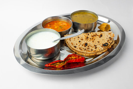 Indian home made food plate or indian thali with steel plate and utensils