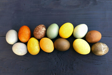 Easter eggs colorful collection on wooden background.