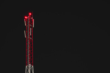 red TV radio signal tower in the starry night