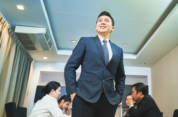 Asian Businessman manager portraits in meeting room with team at office