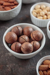 Macadamia nuts on a dark background