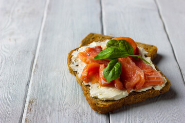 Smoked salmon sandwich with cream cheese. Concept for healthy nutrition.