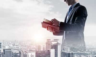 Concept of business success and control with confident boss against cityscape background