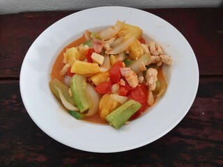 fried pineapple with chicken and vegetables