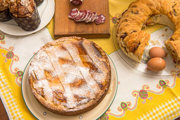 Easter breakfast in Italy whit Colomba cake chocholat egg corallina salami Casatiello cake from Naples and Pastiera cake from campania Region