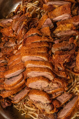 Asian fast food style, fried duck with Chinese noodles at big metal tray