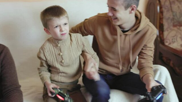 children playing on the console with joysticks in ruhs close-up