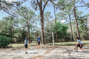 family playing volleyball in moss park in Orlando Florida Lake Nona 