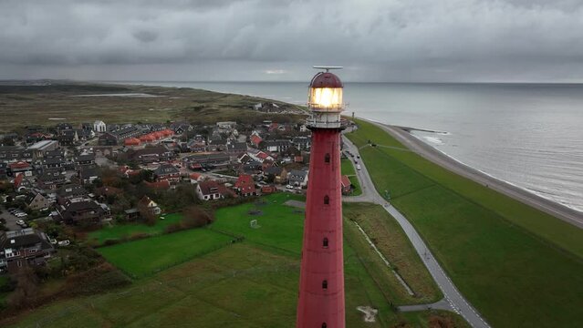 Lighthouse tower Lange Jaap in Den Helder drone aerial footage 5K along the sea near the island of Texel in North Holland, The Netherlands.
