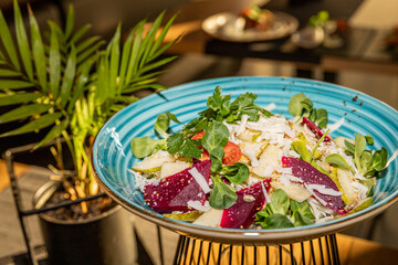 Salad with goat cheese, beetroot and pear