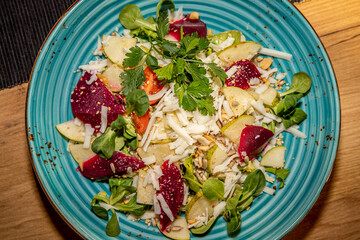 Salad with goat cheese, beetroot and pear