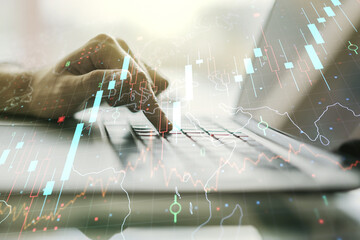Multi exposure of abstract creative financial chart with world map and with hand typing on computer keyboard on background, research and analytics concept