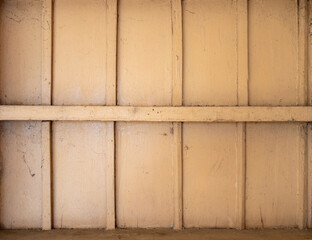 Closeup of the plank wall with the cobweb in the old warehouse.