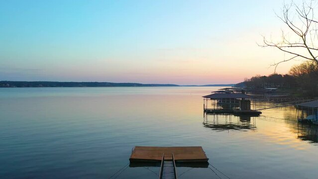 Drone Rising Over Wooden Boat Dock With Bridge On Vacation Destination In Grand Lake O' the Cherokees In Oklahoma. Aerial Tilt-up