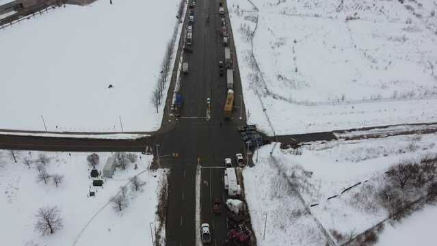 Aerial, trucker's protest in Ottawa, Canada. Trucks causing traffic on road