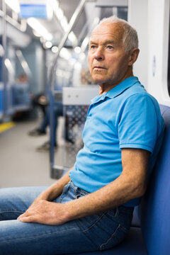Old man sitting in subway car