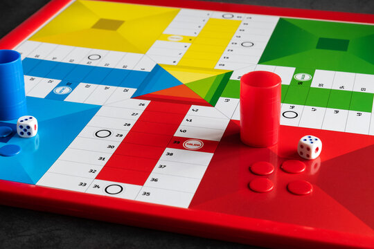 Classic Parcheesi game board with tokens and dice
