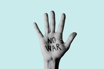 no war written in a raised hand