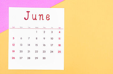 June 2022 calendar on multicolored background.