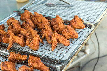 crispy fried chicken on street food market in Thailand. Delicious homemade crispy fried chicken. Crunchy Fried Chicken Ready To Eat