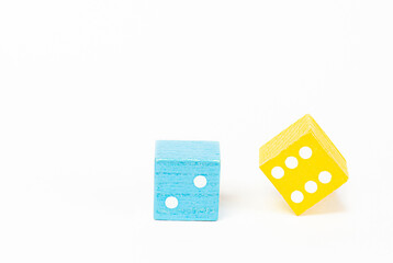 blue and yellow playing dice isolated on white background
