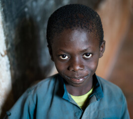 Close-up Portrait of African black Boy portrait inside of school classroom. High quality photo