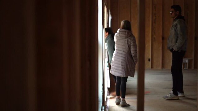 Young family is building a new home and complaining about the unfinished work outside