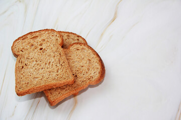 square slices of toasted dark rye bread