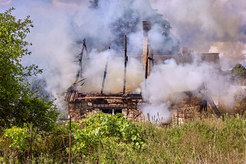 Fototapeta na wymiar extinguishing the fire destroyed the village house