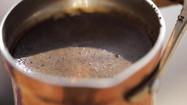 Copper Cezve for coffee in winter mountains