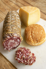sesame sandwich with salami and cheese