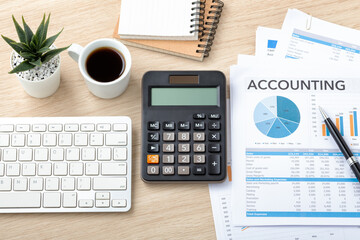 Accounting concept with calculator, accounting paper and computer keyboard