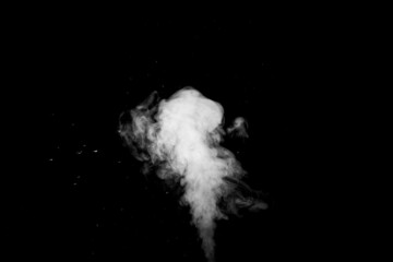 Curly white steam rising up and splashing water scattering in different directions isolated on a black background. Evaporation of liquid and condensation. Can be used as background, design element