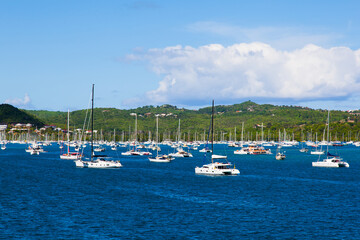 Fototapeta na wymiar Bay of the island of Martinique French Polynesia. Yachts stand in the bay in the summer. Holidays in Martinique.
