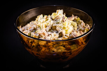 a bowl of chicken salad with mushrooms